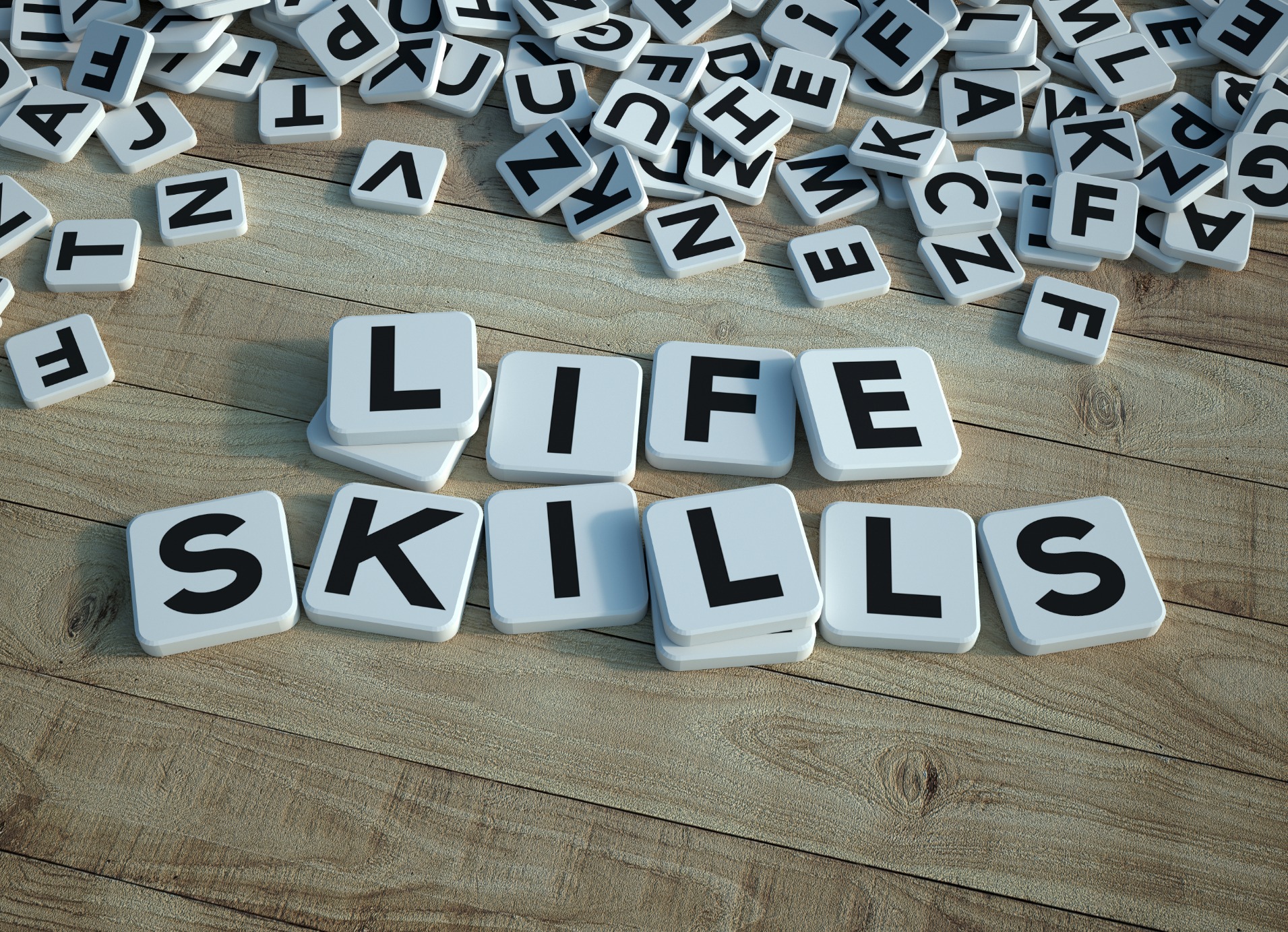 Tiles spelling out life skills